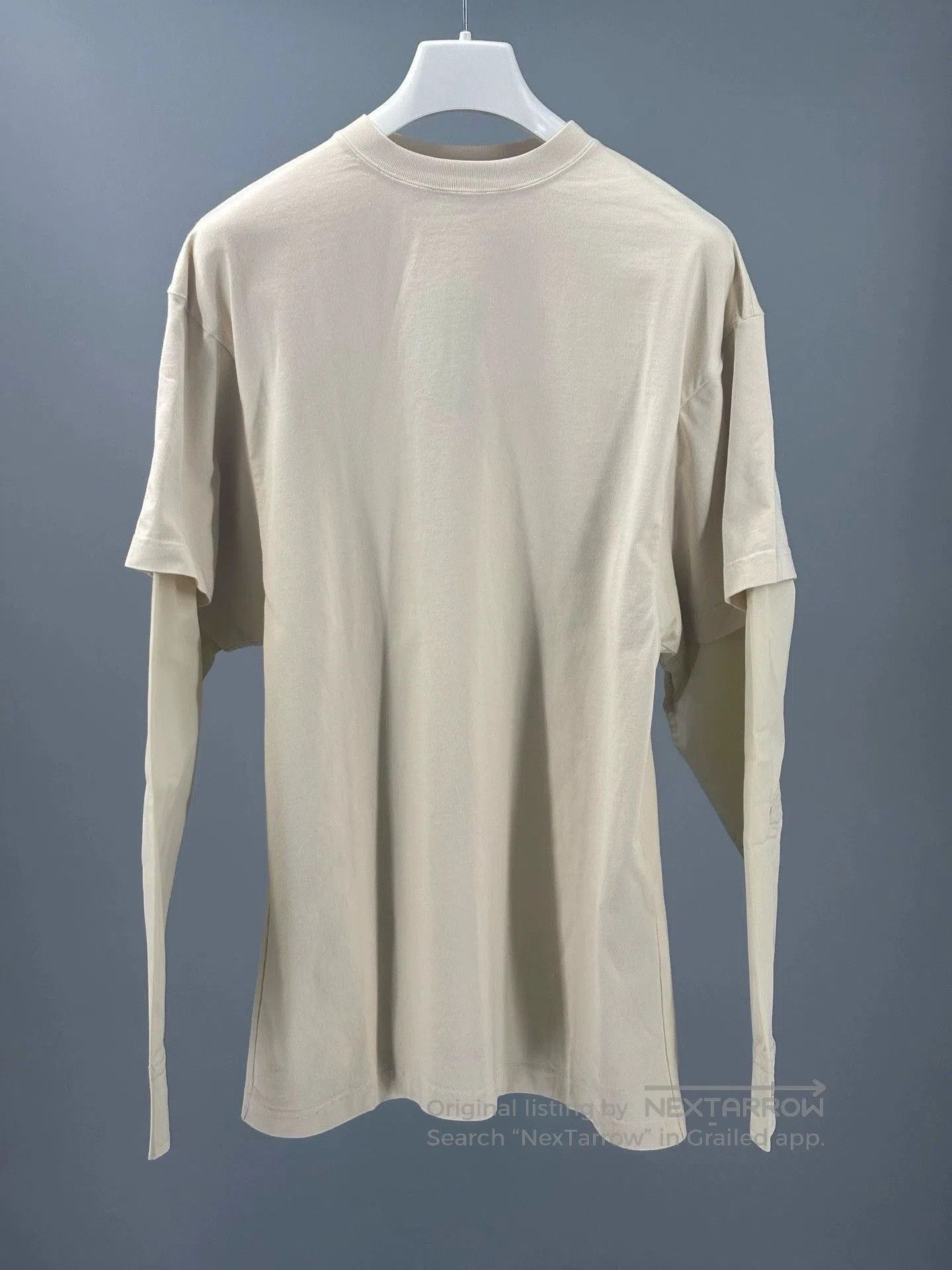 beige long sleeve t-shirt with embroidery.