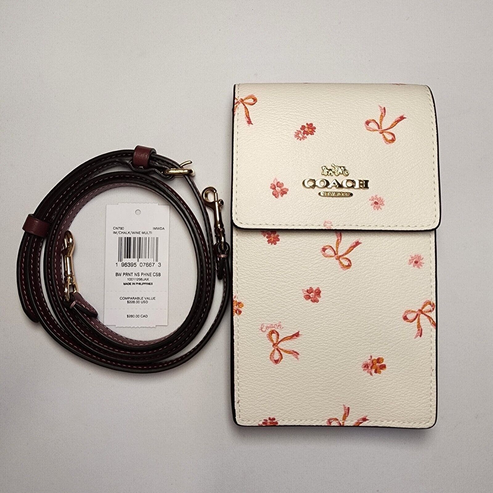 image of NWT Coach Cn780 North South Phone Crossbody With Bow Print in White, Women's