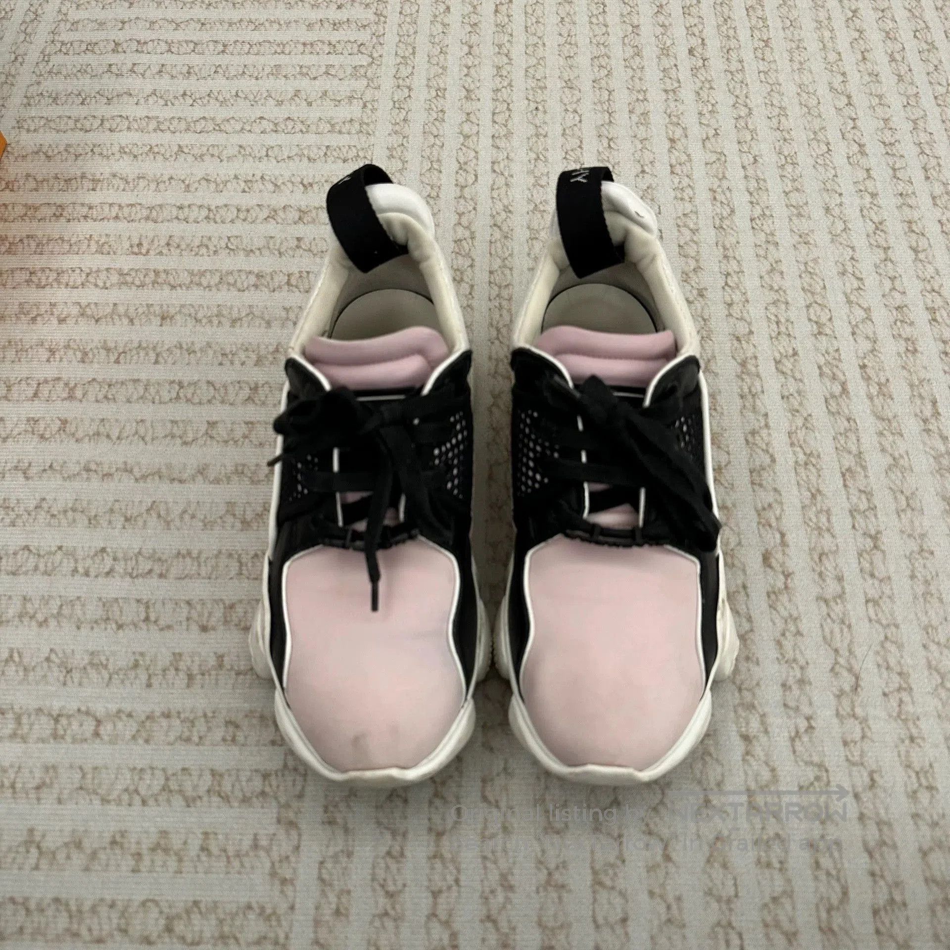 givenchy chunky dad sneakers in black and pink.