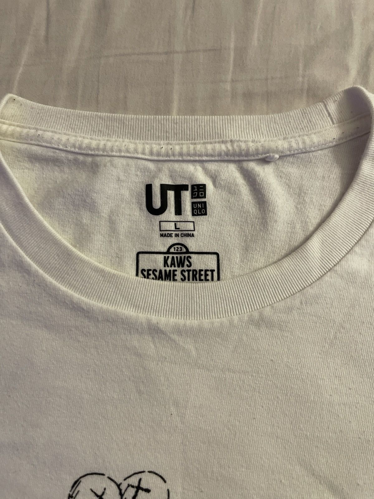Kaws × Uniqlo KAWS X SESAME STREET Size US L / EU 52-54 / 3 - 2 Thumbnail