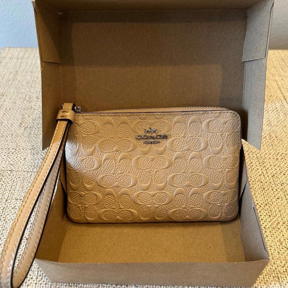 Coach COACH Signature Debossed Patent Leather Wristlet in Platinum Size ONE SIZE - 1 Thumbnail