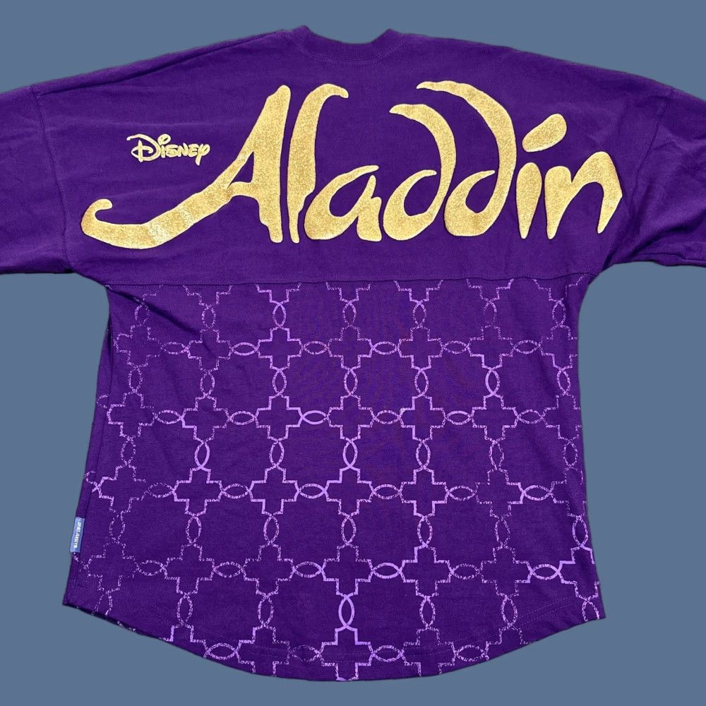 Disney VINTAGE? No — Disney Aladdin Spirit Jersey Shirt Womens XS Long Sleeve Genie Glitter Graphic Crew Neck Purple Size XS / US 0-2 / IT 36-38 - 1 Thumbnail