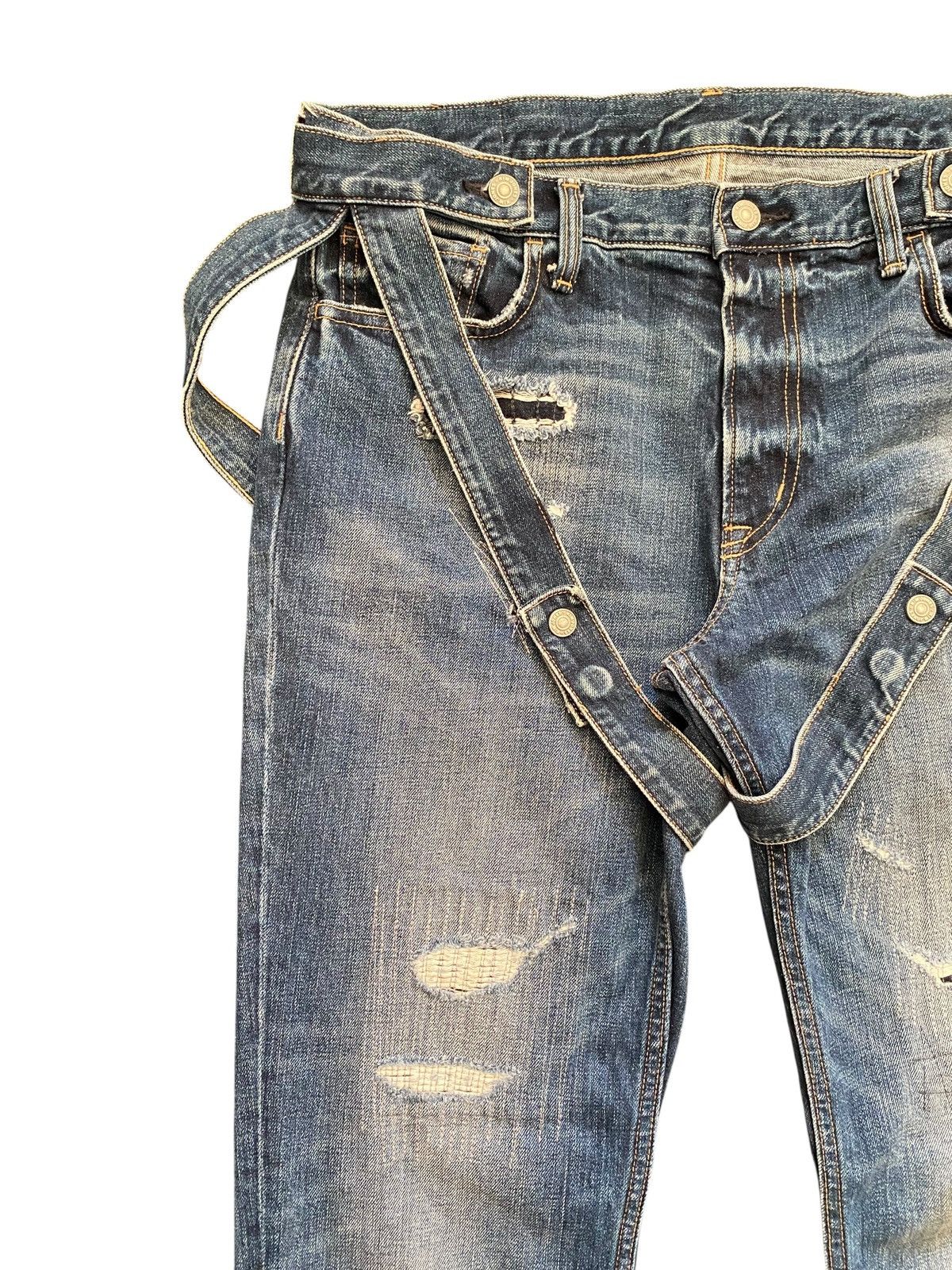 Kim Jones x GU distressed bondage denim