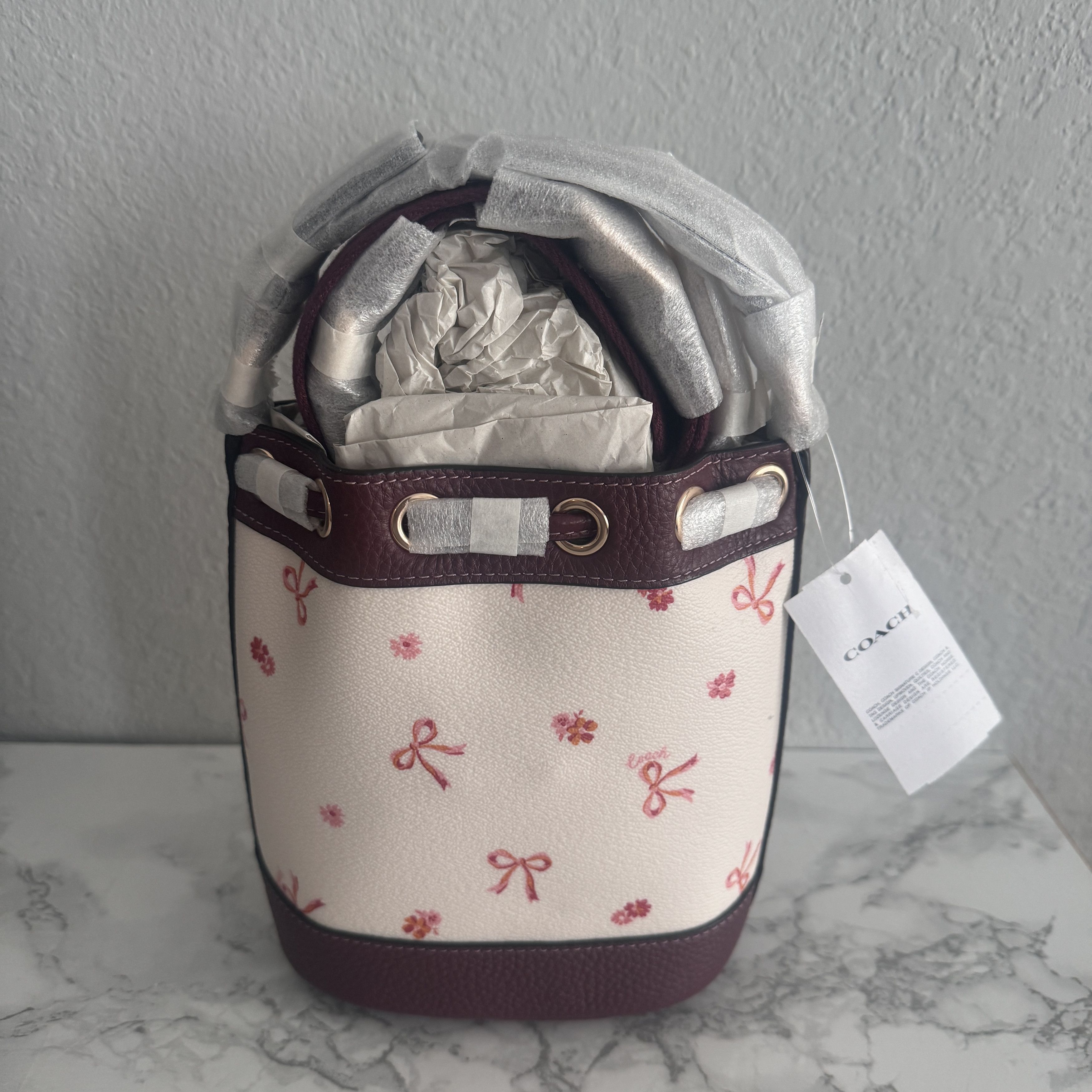 image of Coach Dempsey Drawstring Bucket Bag 15 With Bow Print, Women's
