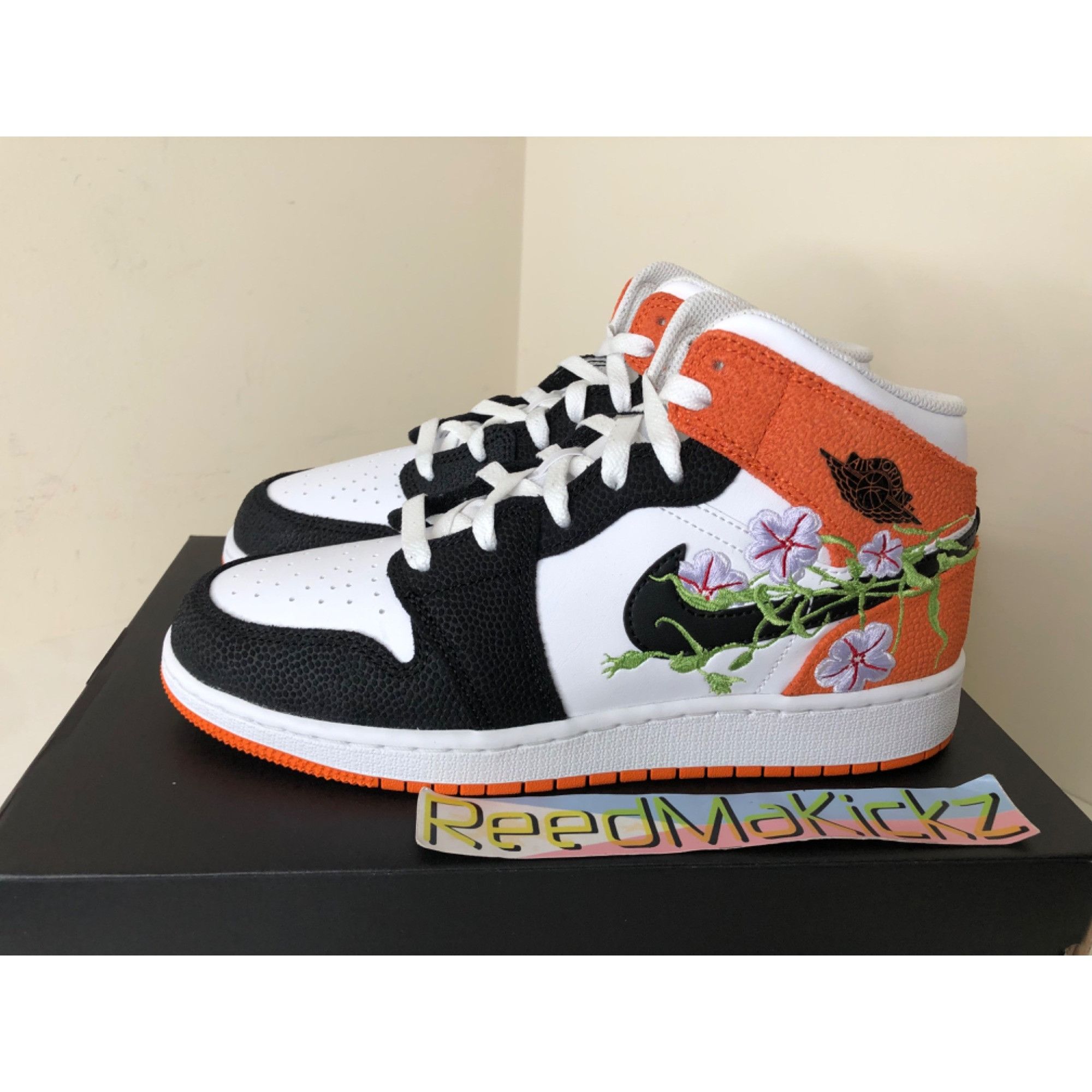 image of Jordan Brand 1 Mid Se Floral Starfish Gs 5Y Shoes in Orange, Men's