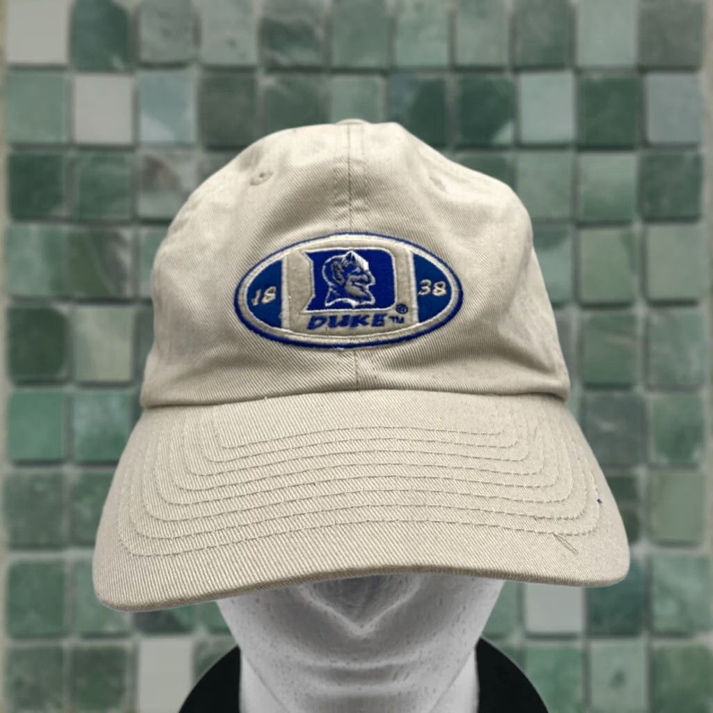 Vintage VINTAGE Duke Blue Devils Adjustable Strap Pro Player Ball Cap Khaki Mens One Size Tan Embroidered Baseball Hat Hat Adjustable Strapback Brand No Brand Size ONE SIZE - 1 Thumbnail
