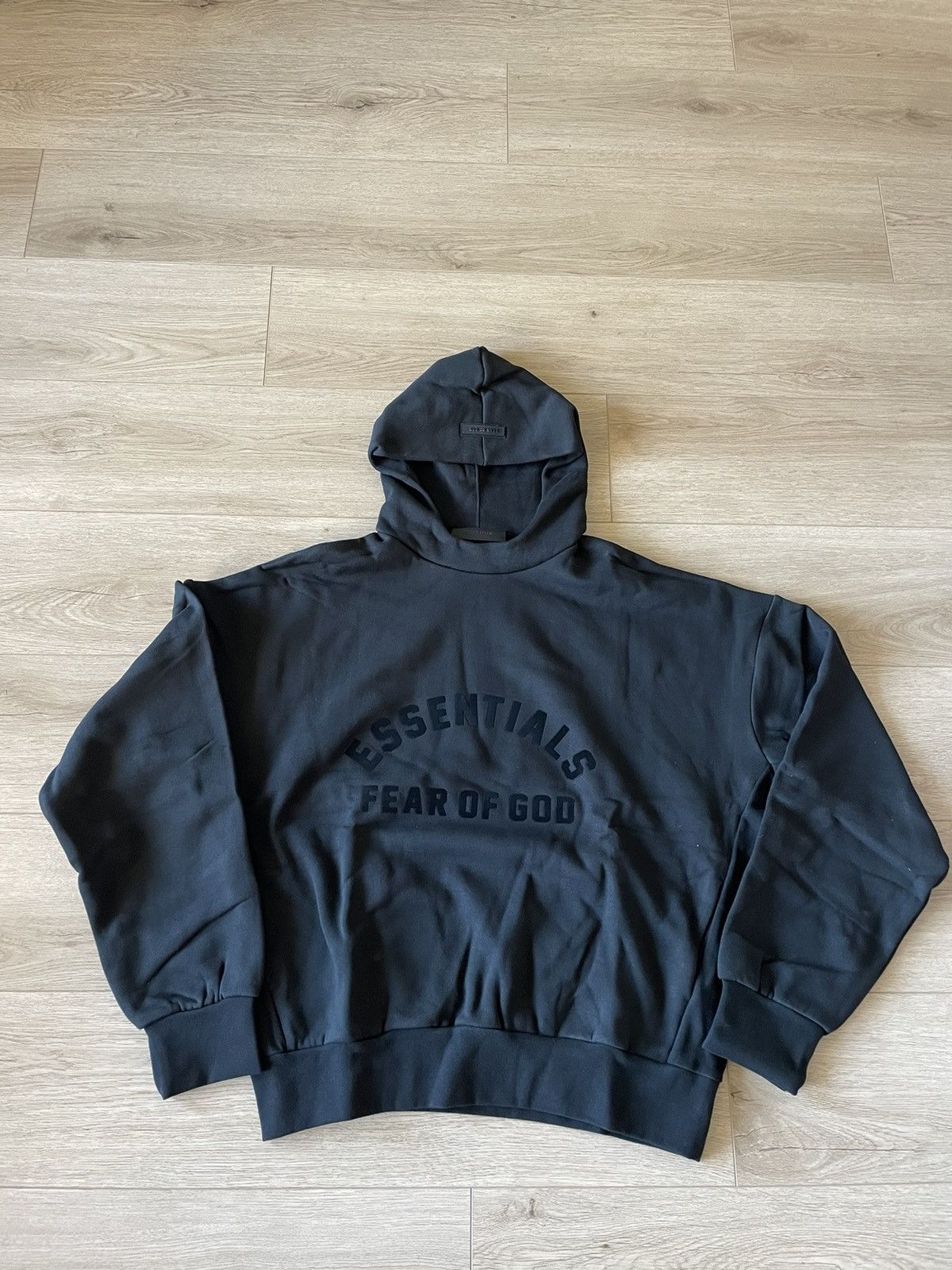 Fear of God Fear of God Essentials Jet Black Hoodie Grailed