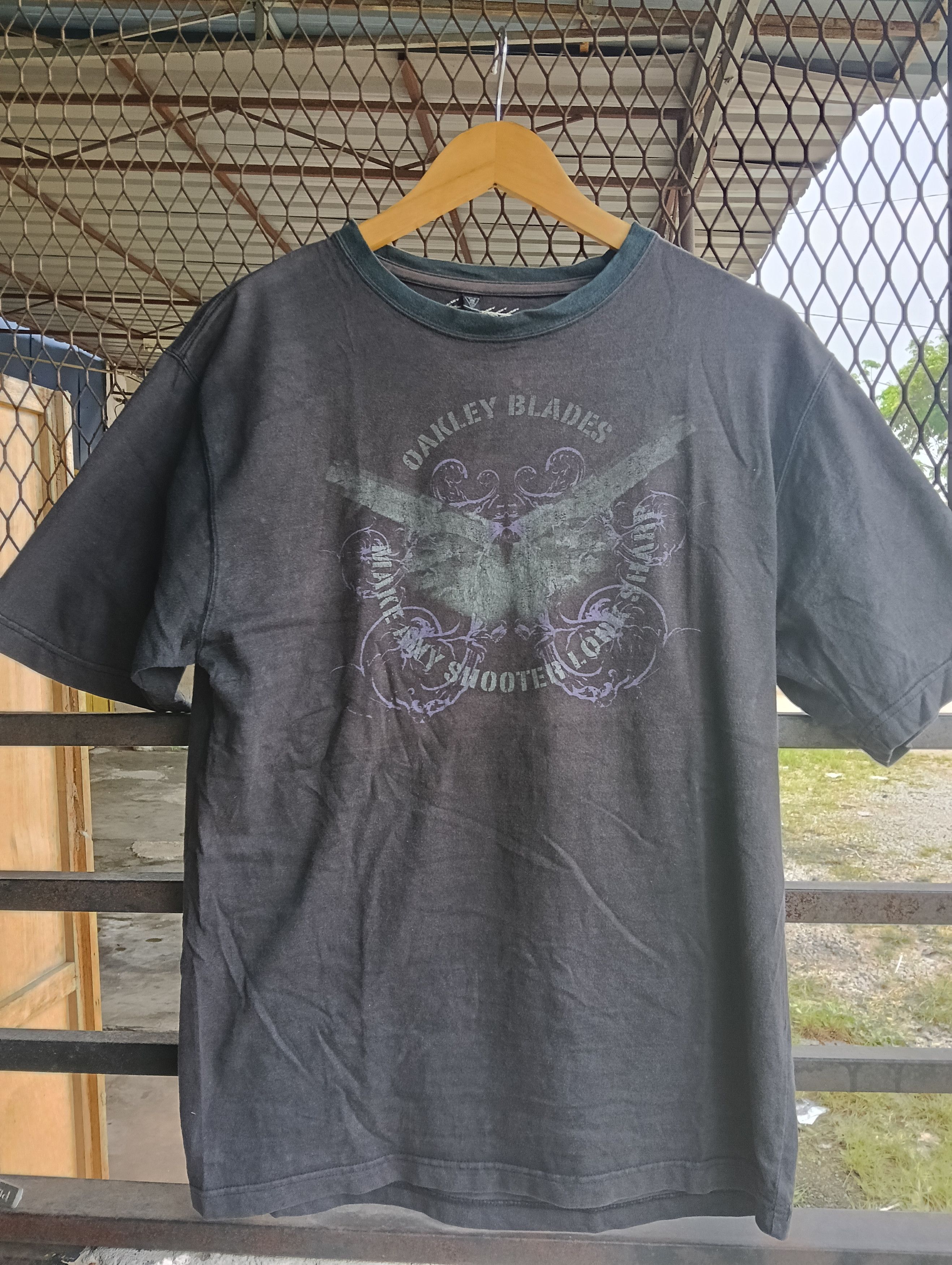 Vintage Oakley blades make any shooter faded black.