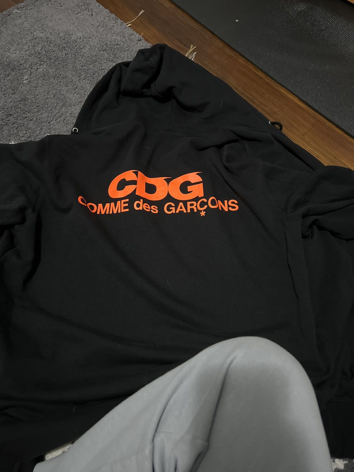 image of Cdg Cdg Cdg Cdg Neon Orange Hoodie in Black, Men's (Size 2XL)