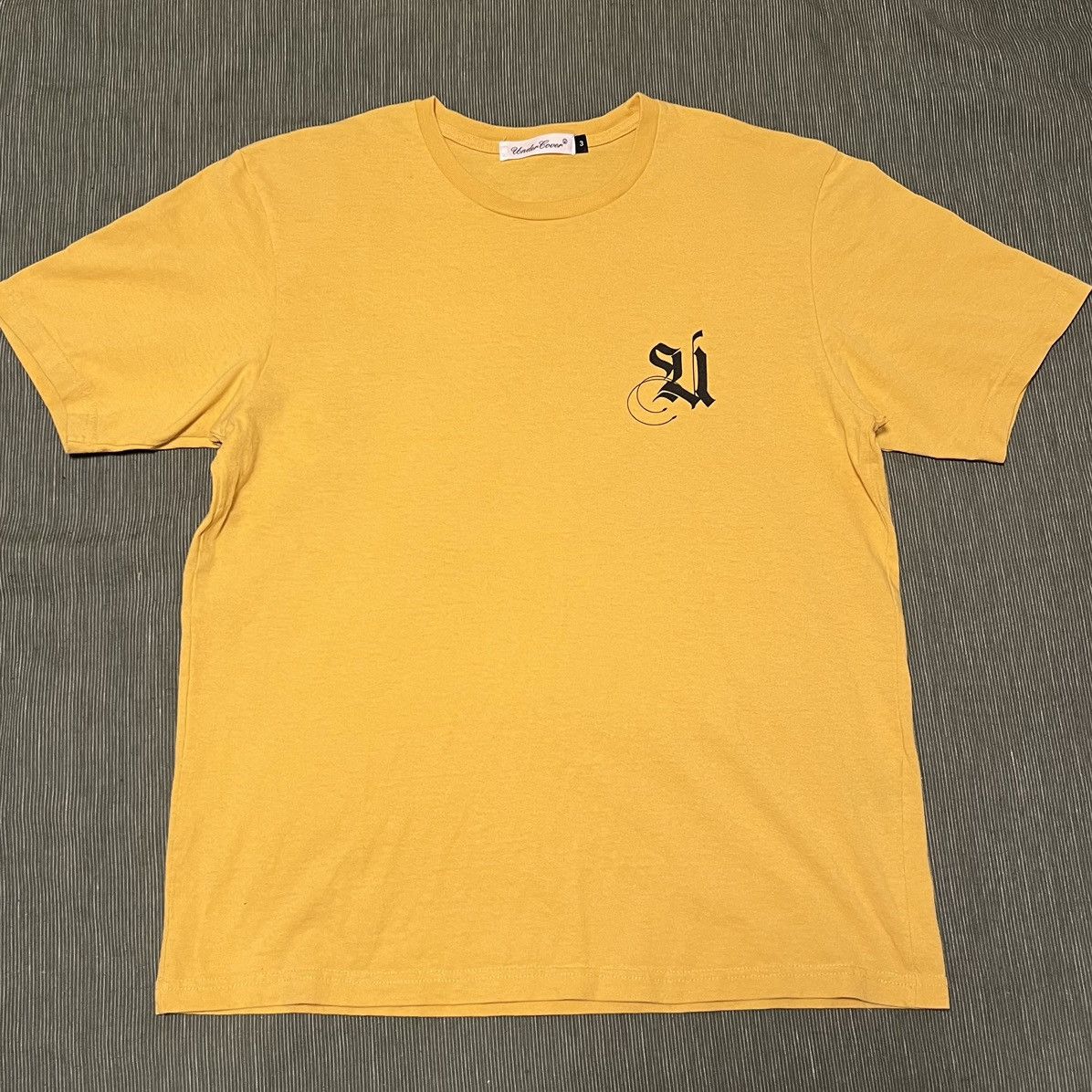 Undercover Undercover old english logo Size US L / EU 52-54 / 3 - 1 Thumbnail