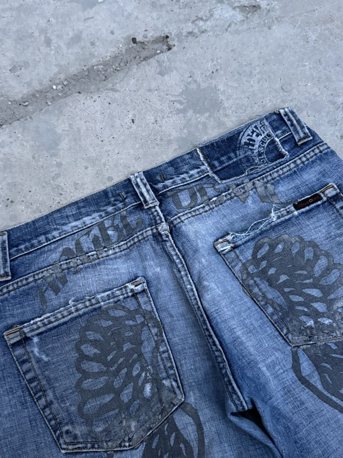 VINTAGE DISTRESSED WINGS DENIM JEANS
