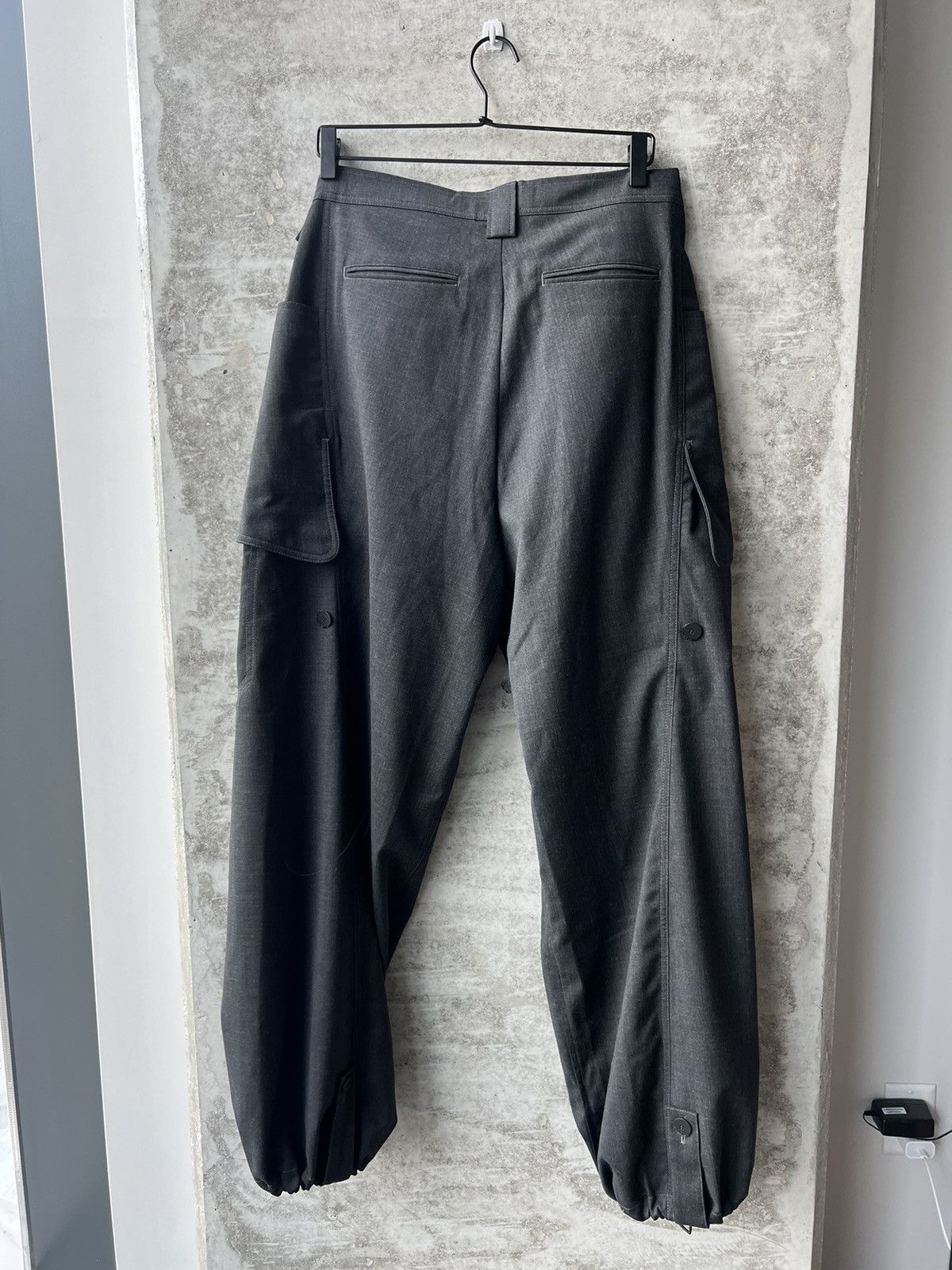 Kiko Kostadinov Meno Trousers in Charcoal Grey | Grailed