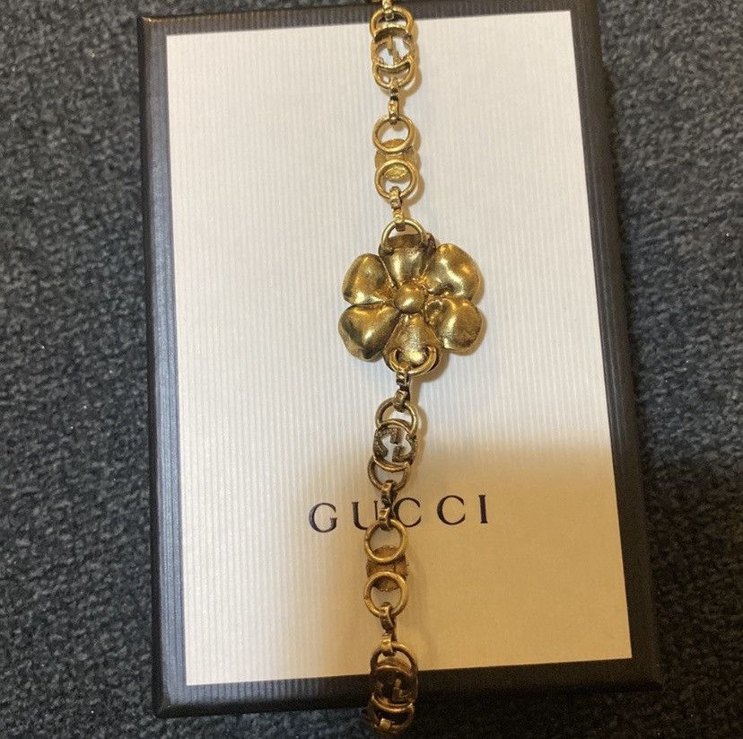 image of Gucci Floral Metal Bracelet In Aged Gold, Women's