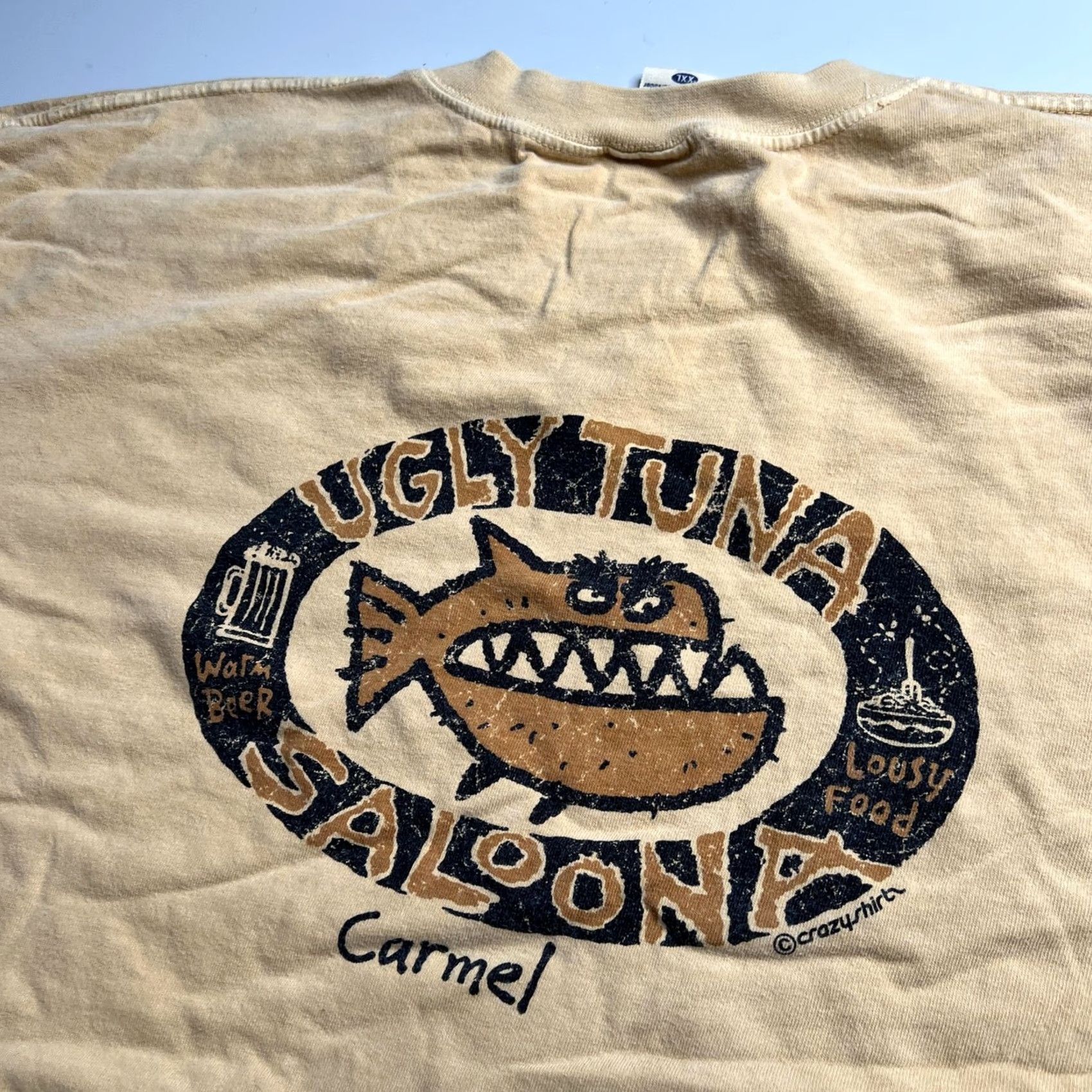 Vintage VINTAGE Crazy Shirts Mens 2XL Beige Ugly Tuna Saloona Carmel Beer Fish Graphic Tee Shirt Size US XXL / EU 58 / 5 - 7 Thumbnail