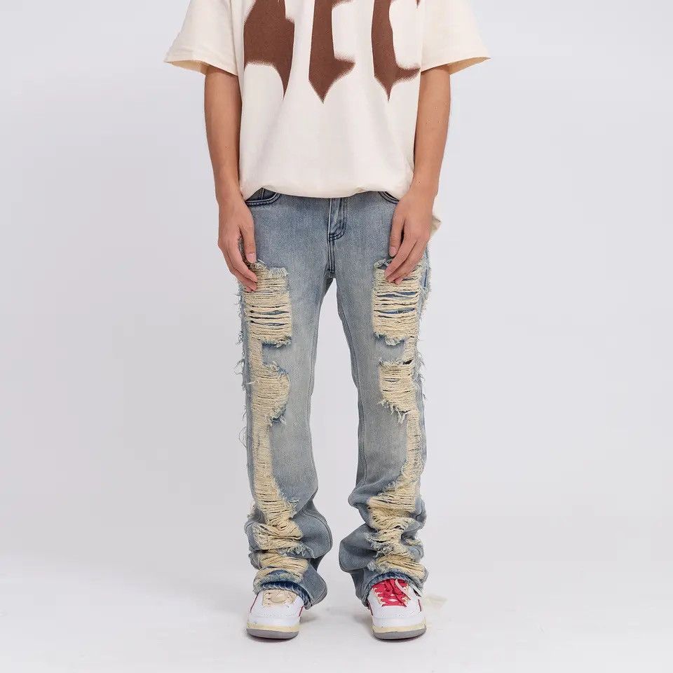 Ripped frayed hole blue washed baggy trousers jeans