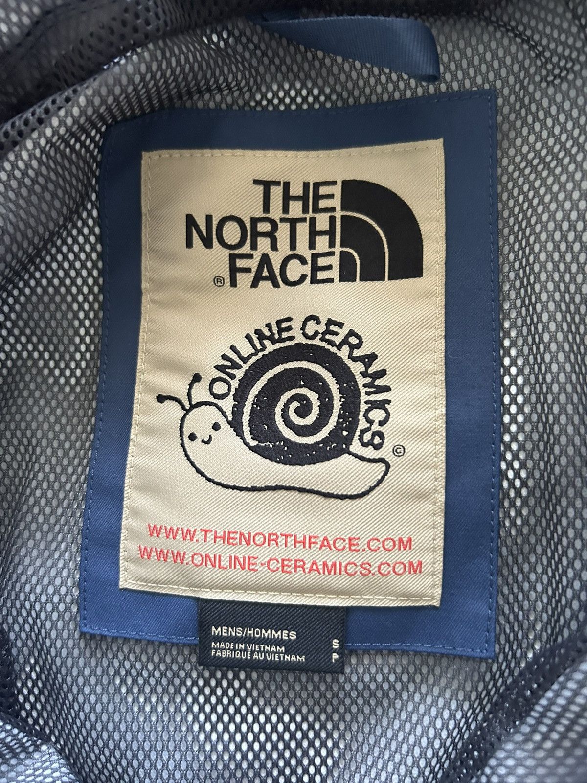 Online Ceramics × The North Face THE NORTH FACE X ONLINE CERAMICS MENS WIND JAMMER JACKET Size US S / EU 44-46 / 1 - 7 Thumbnail