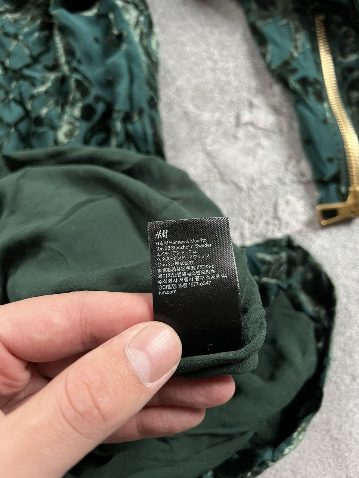 blonde woman in green dress Hunter Green Velvet Honeycomb Print Dress – Fallon's main image 0