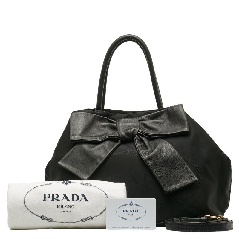 image of Prada Canapa Logo Bow Handbag in Black, Women's