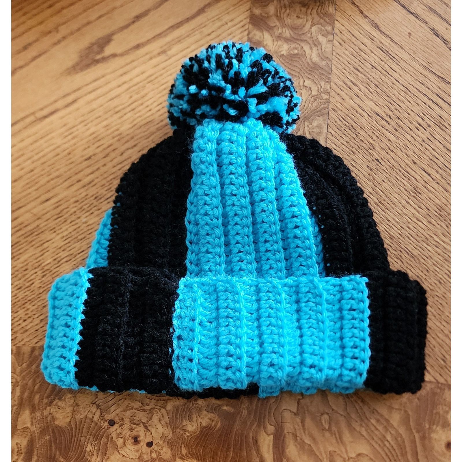 Handmade Handcrafted crocheted blue and black winter beanie. Size ONE SIZE - 1 Thumbnail