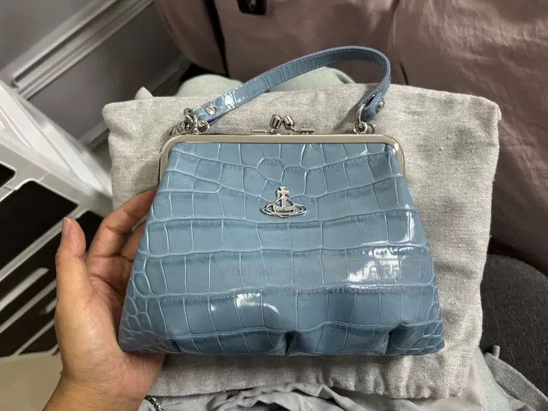 Vivienne Westwood size os Light blue crocodile skin dumplin