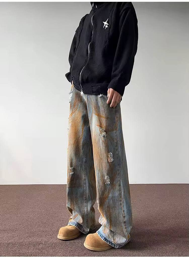 ripped casual jeans in a rust color.
