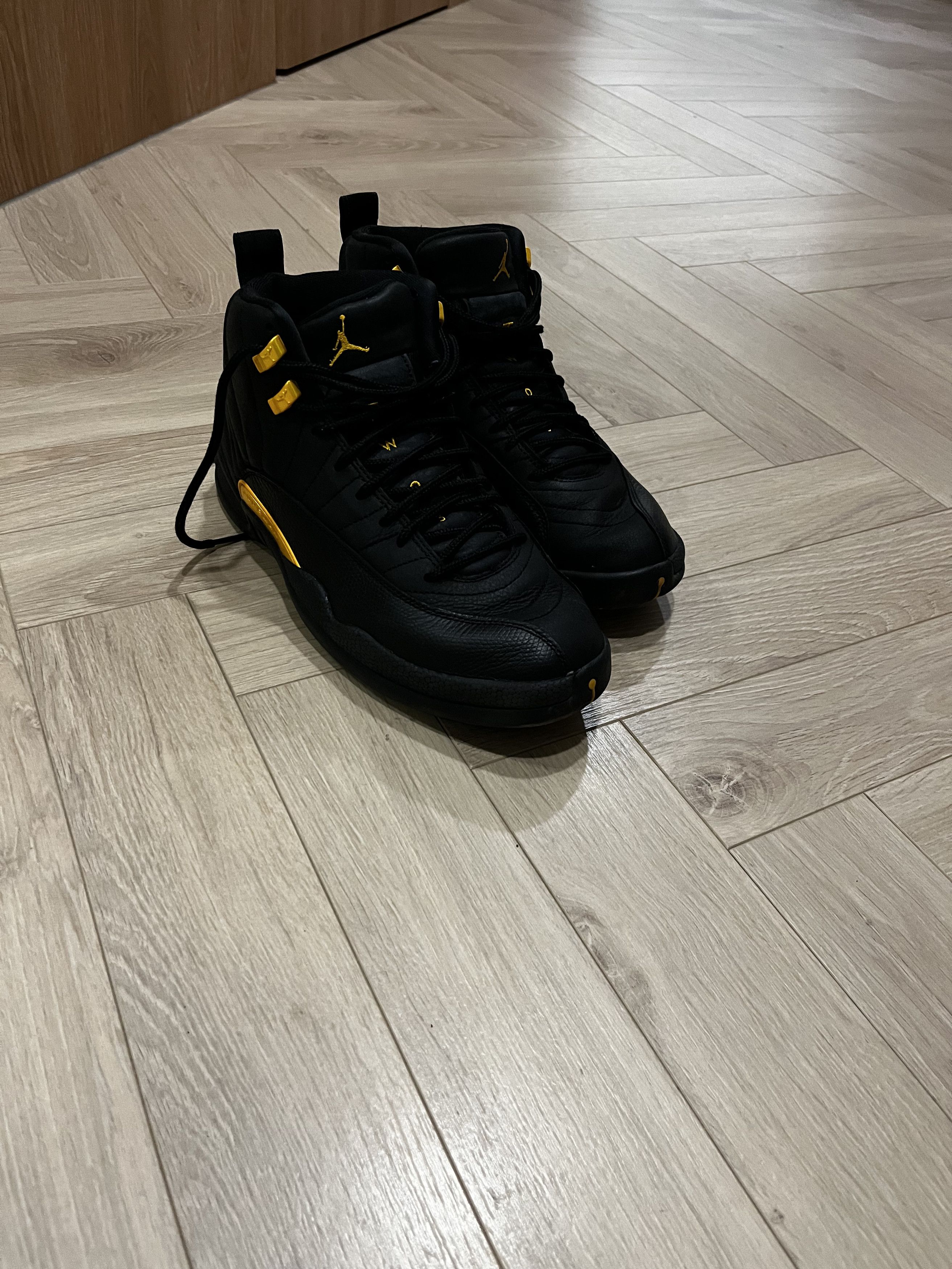 image of Jordan Brand 12 Black Taxi Shoes, Men's (Size 10)