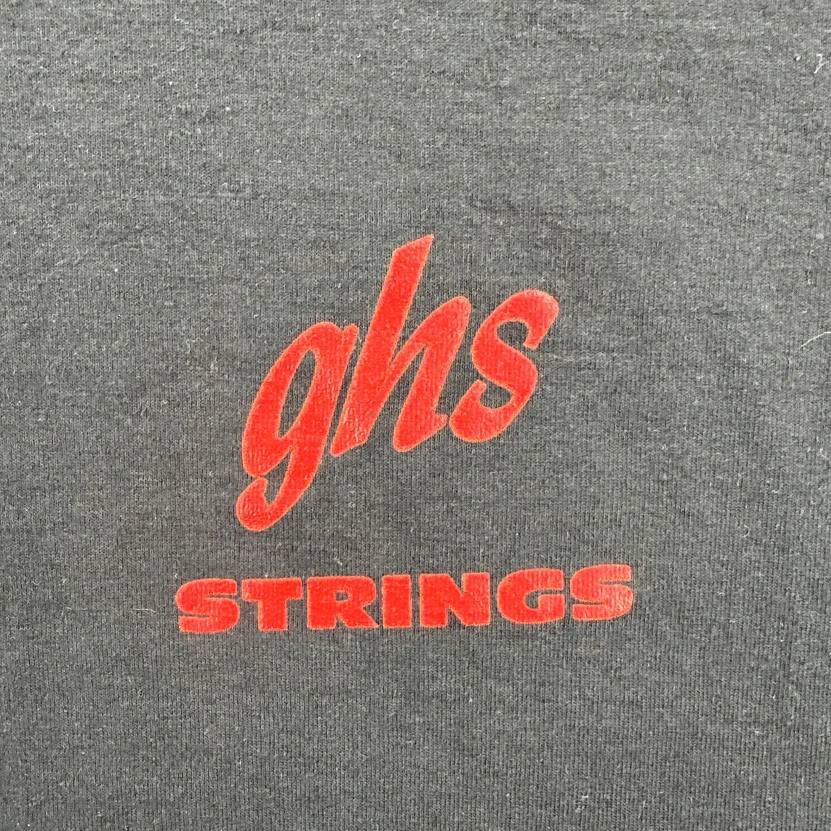 Vintage VINTAGE GHS STRINGS Boomers Guitar And Bass Strings Mens Large Black T Shirt 90s Size US L / EU 52-54 / 3 - 7 Thumbnail