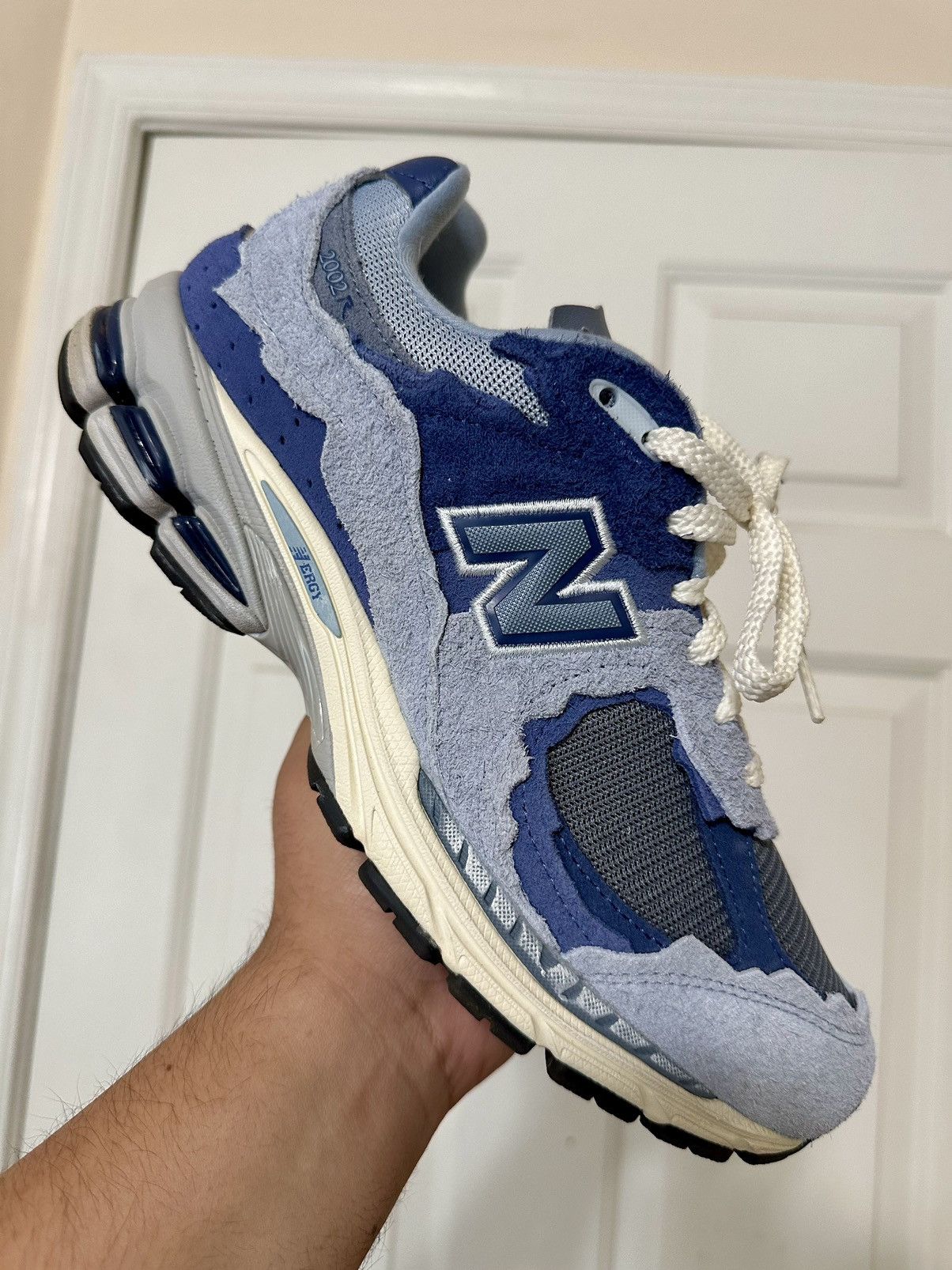 image of New Balance 2002R Protection Pack Blue 8.5 Shoes, Men's