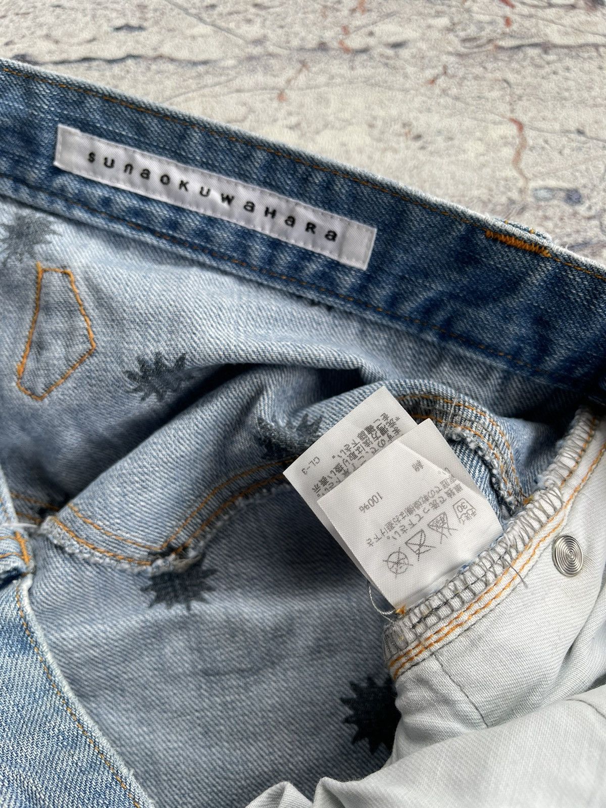Sunao kuwahara distressed jeans by issey miyake