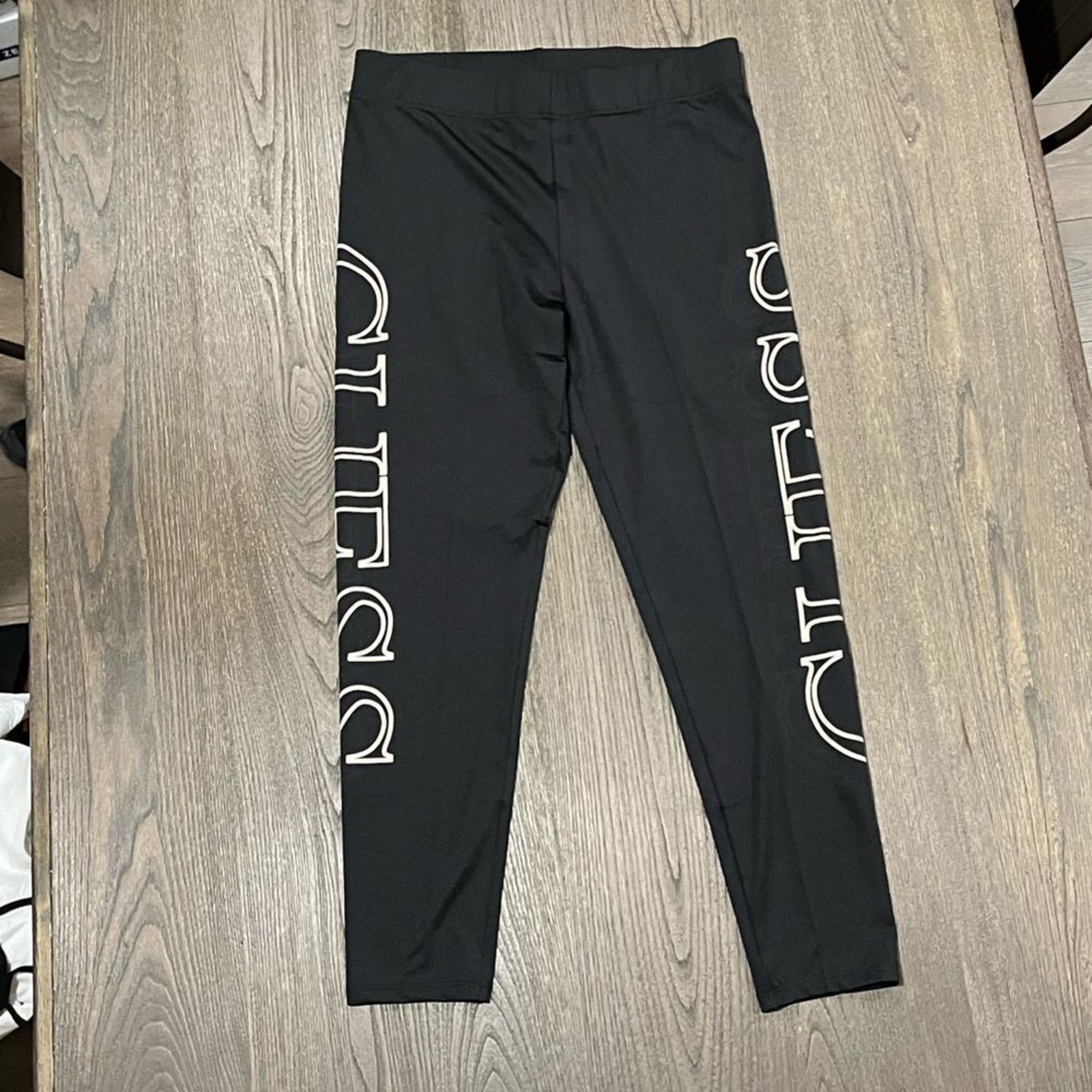 Guess NWOT Guess Black Cropped Capri Leggings Logo Print Size L Size 29" - 1 Thumbnail