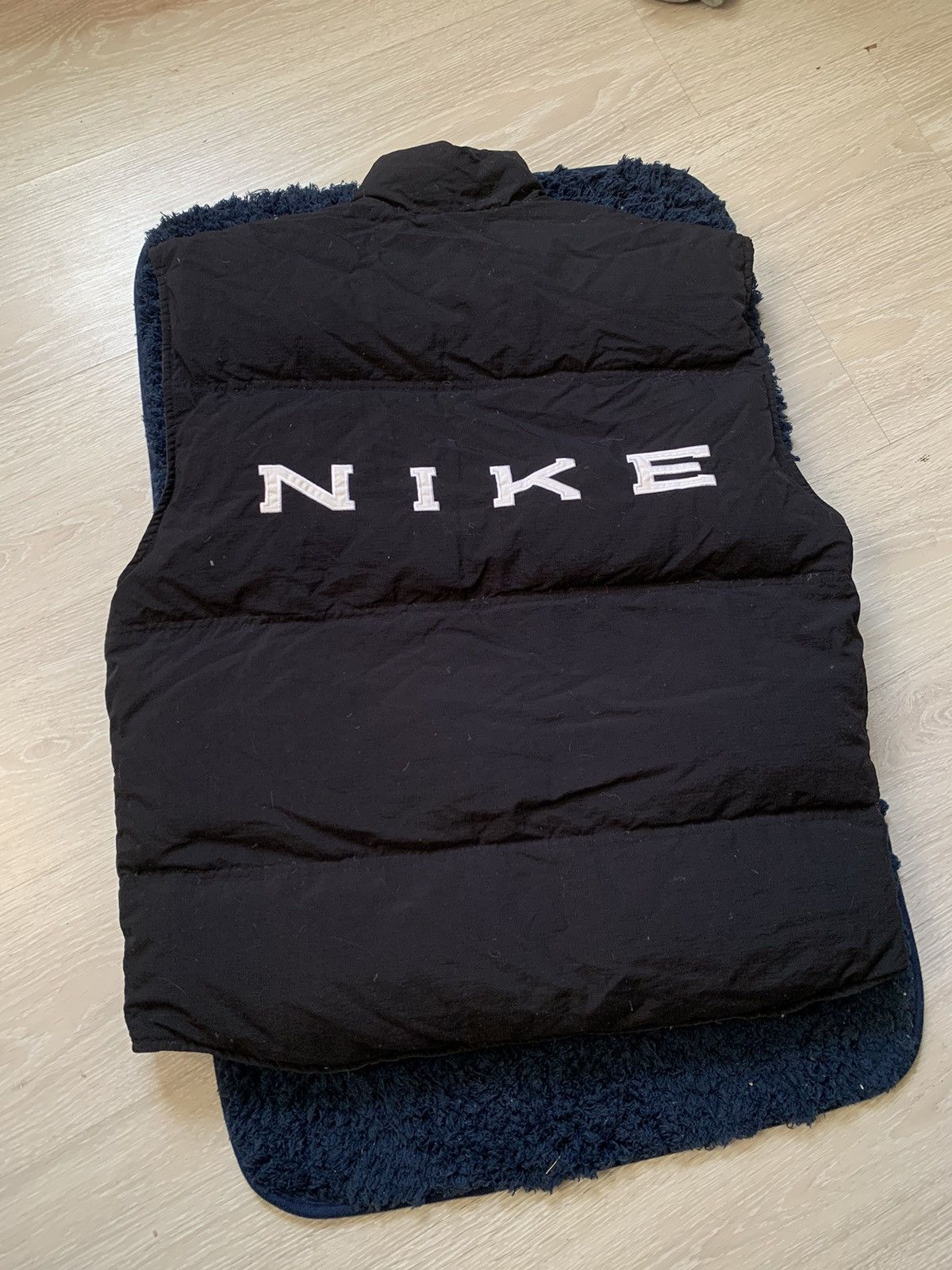 image of Nike Big Center Logo Down Puffer Vest Double-Sided in Black, Men's (Size Large)