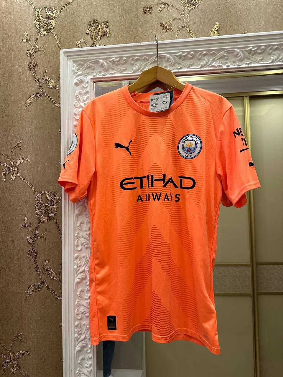 image of Manchester City 2022/2023 Puma Football Jersey Ederson 13 in Orange, Men's (Size Medium)
