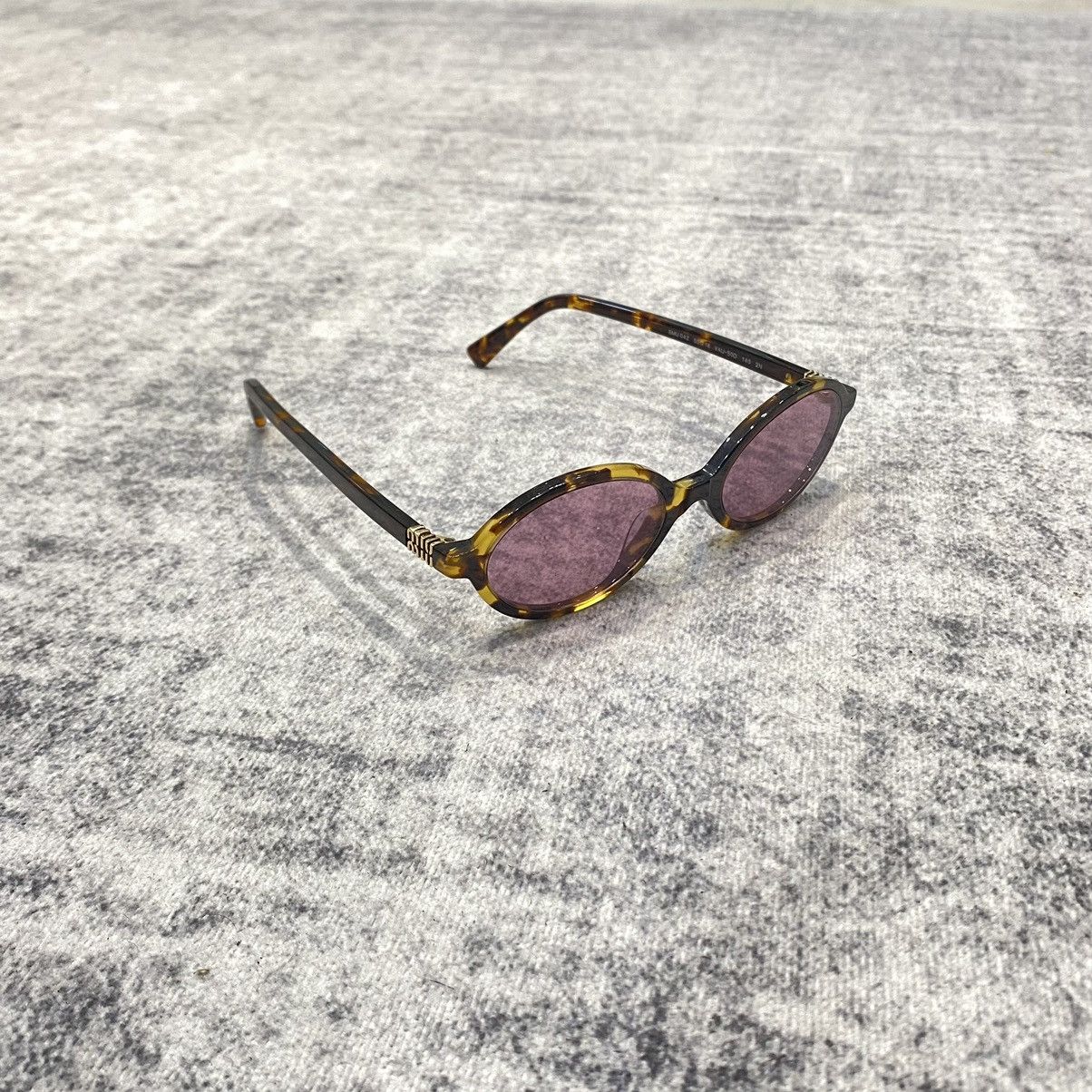 Miu Miu MIU MIU MU 04ZS VAU50D Eyewear HONEY Size ONE SIZE - 1 Thumbnail
