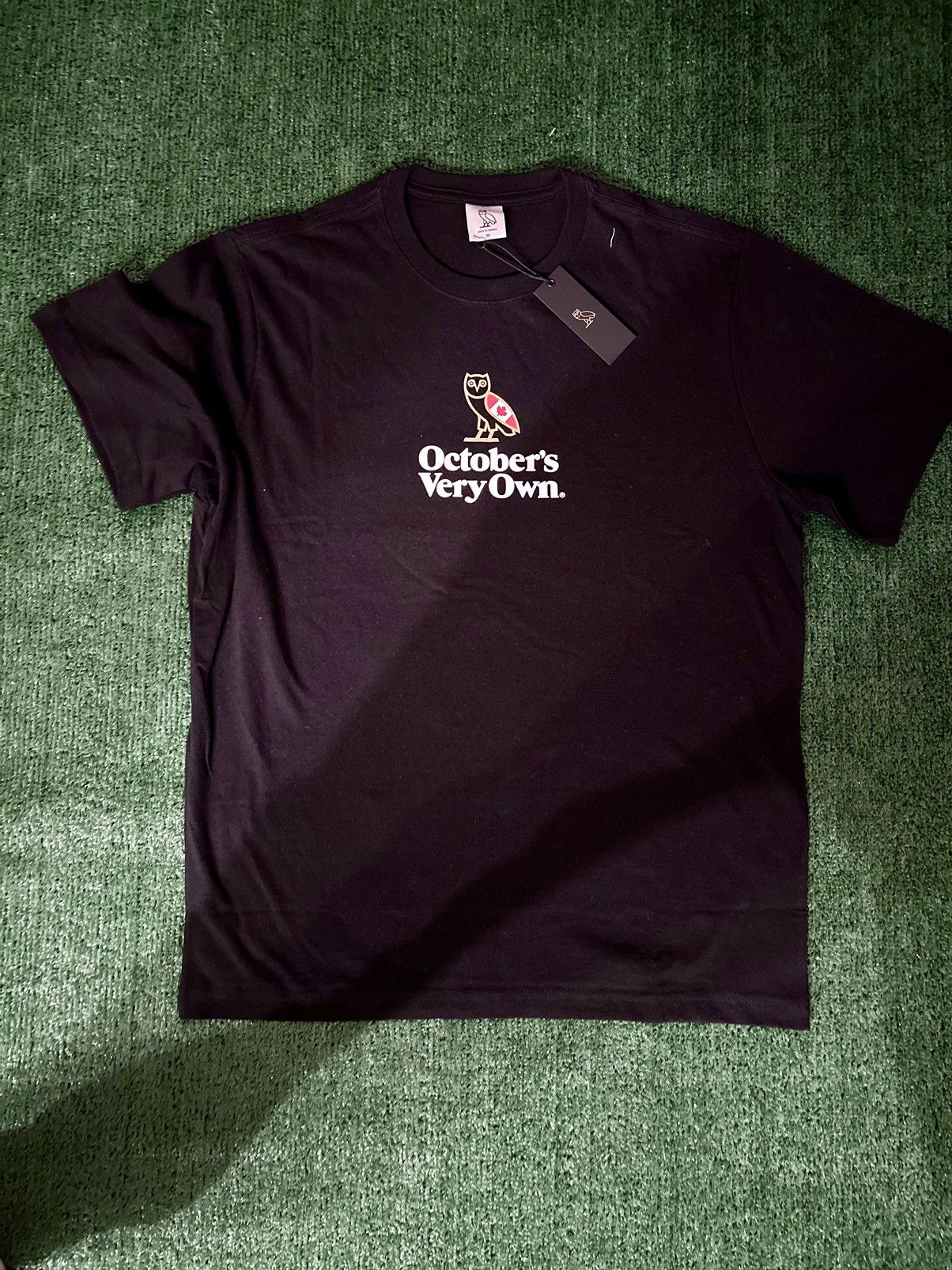 image of Drake x Octobers Very Own Ovo Canada Flag Mini Owl T-Shirt in Black, Men's (Size Medium)