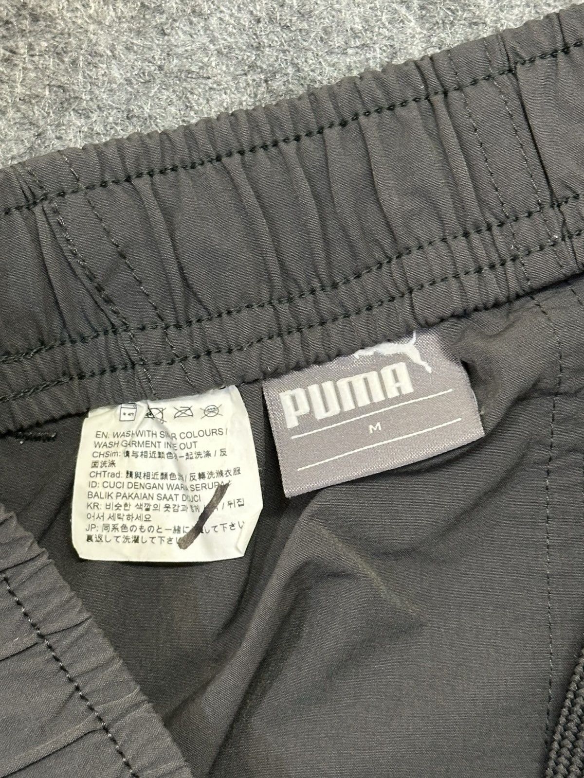 Puma PUMA dark grey track pants with a 3/4 length. Size US 30 / EU 46 - 11 Thumbnail