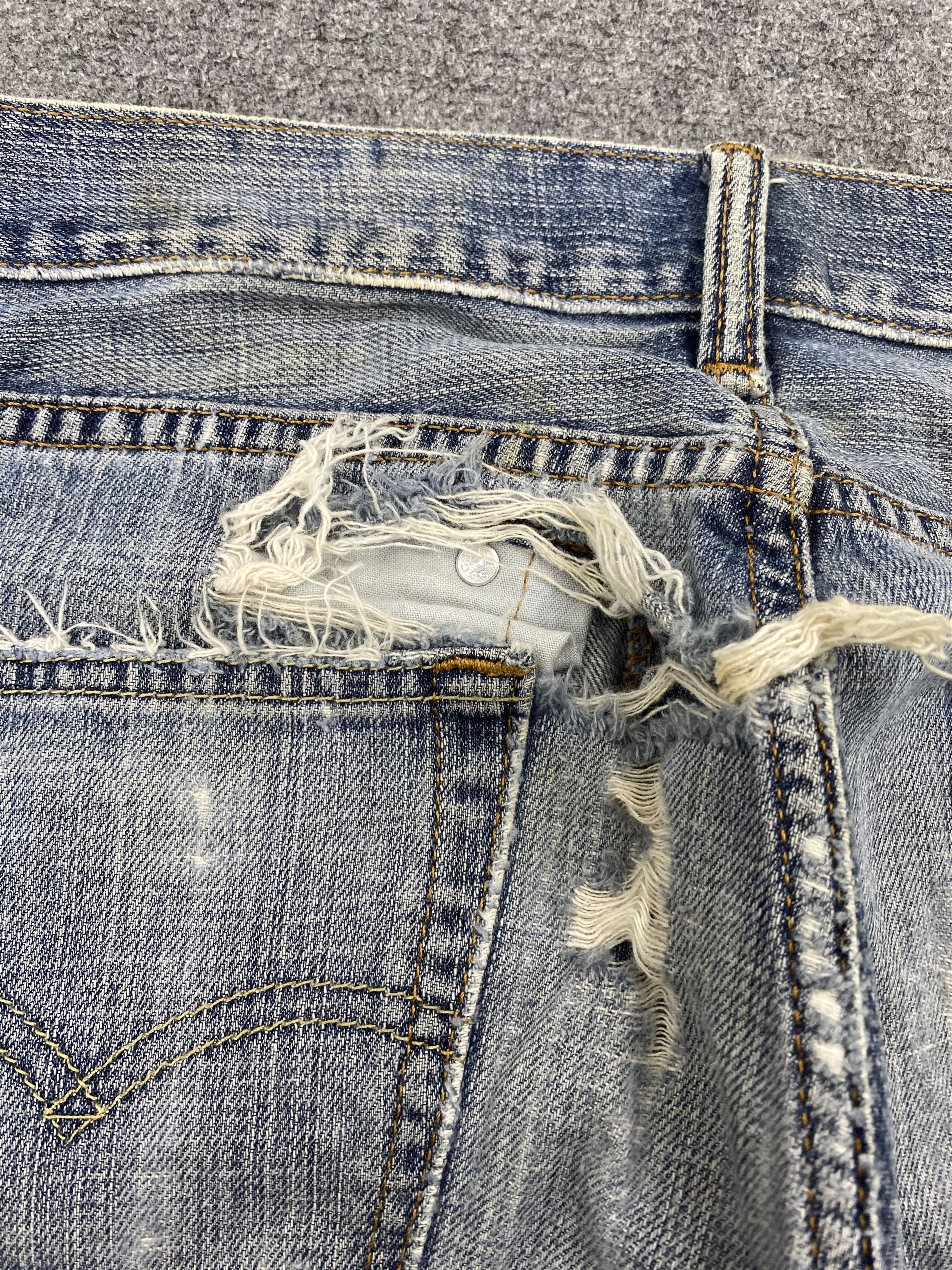 Distressed Vintage Levi's 505 Faded Blue Jeans