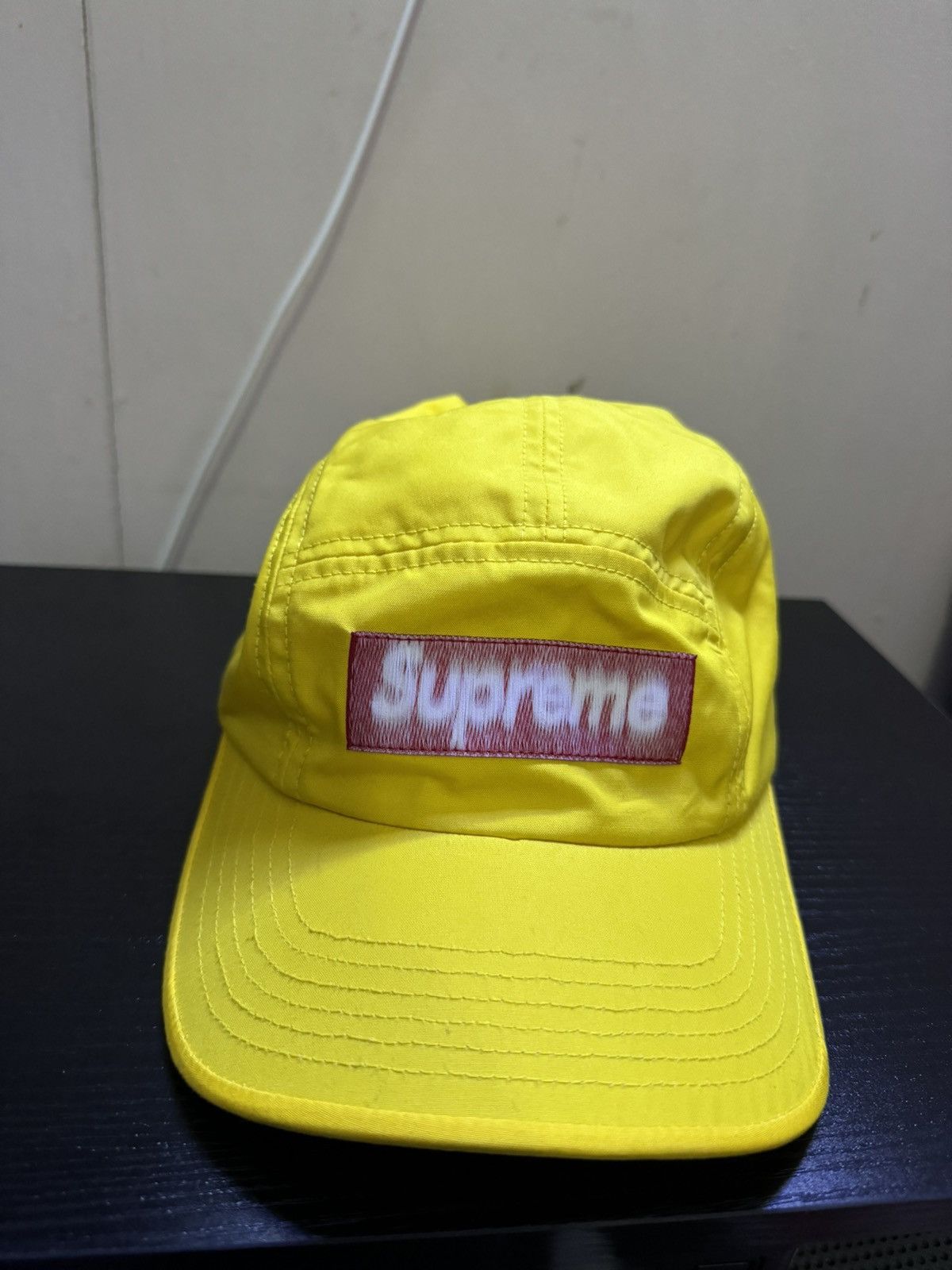 Yellow Supreme SS21 reversed label camo hat