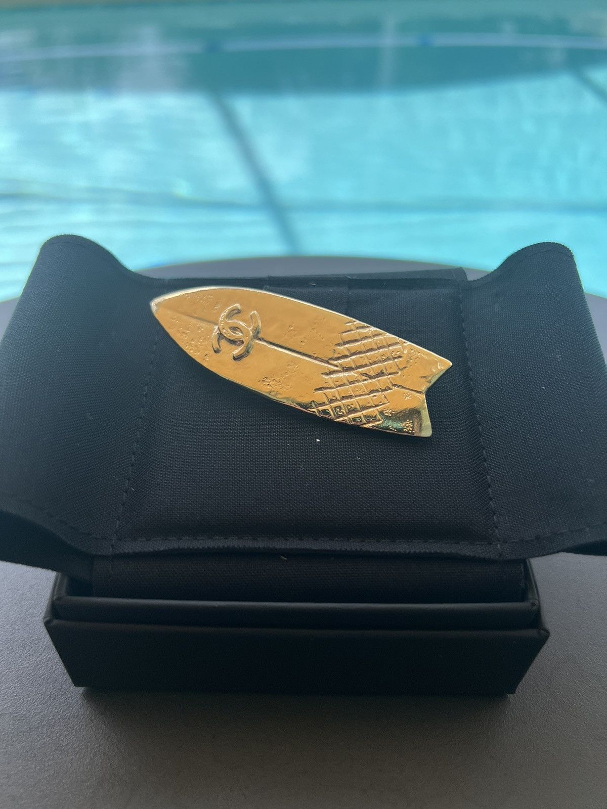 Amazing Chanel gold surfboard brooch.