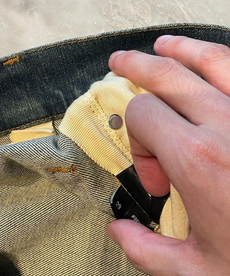 Amiri yellow mud washed blue jeans