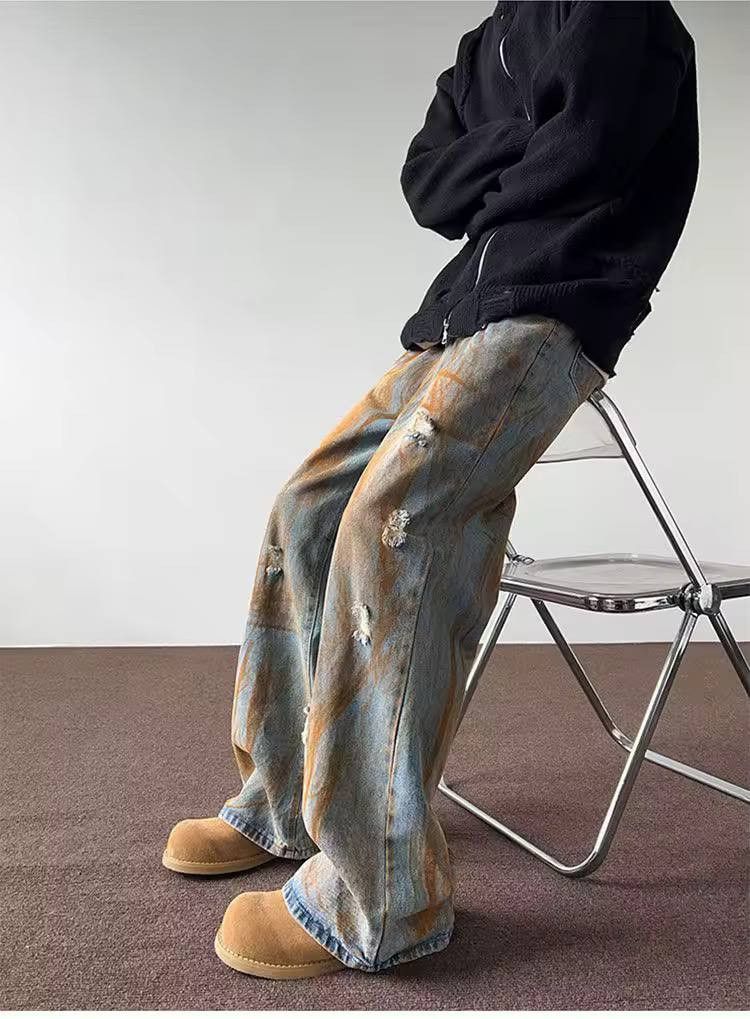ripped casual jeans in a rust color.