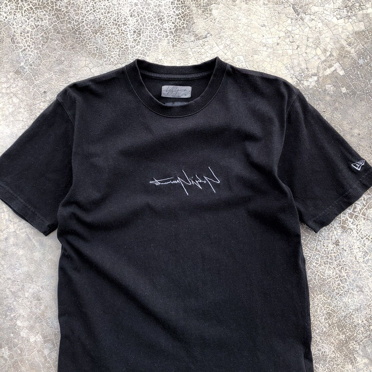 New Era × Yohji Yamamoto New Era x Yohji Yamamoto Embroidered Sign T-Shirt  | Grailed