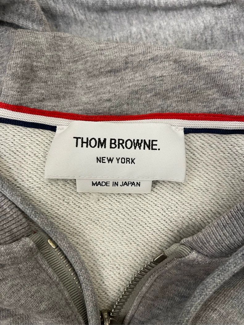Thom Browne A trench coat with a hood