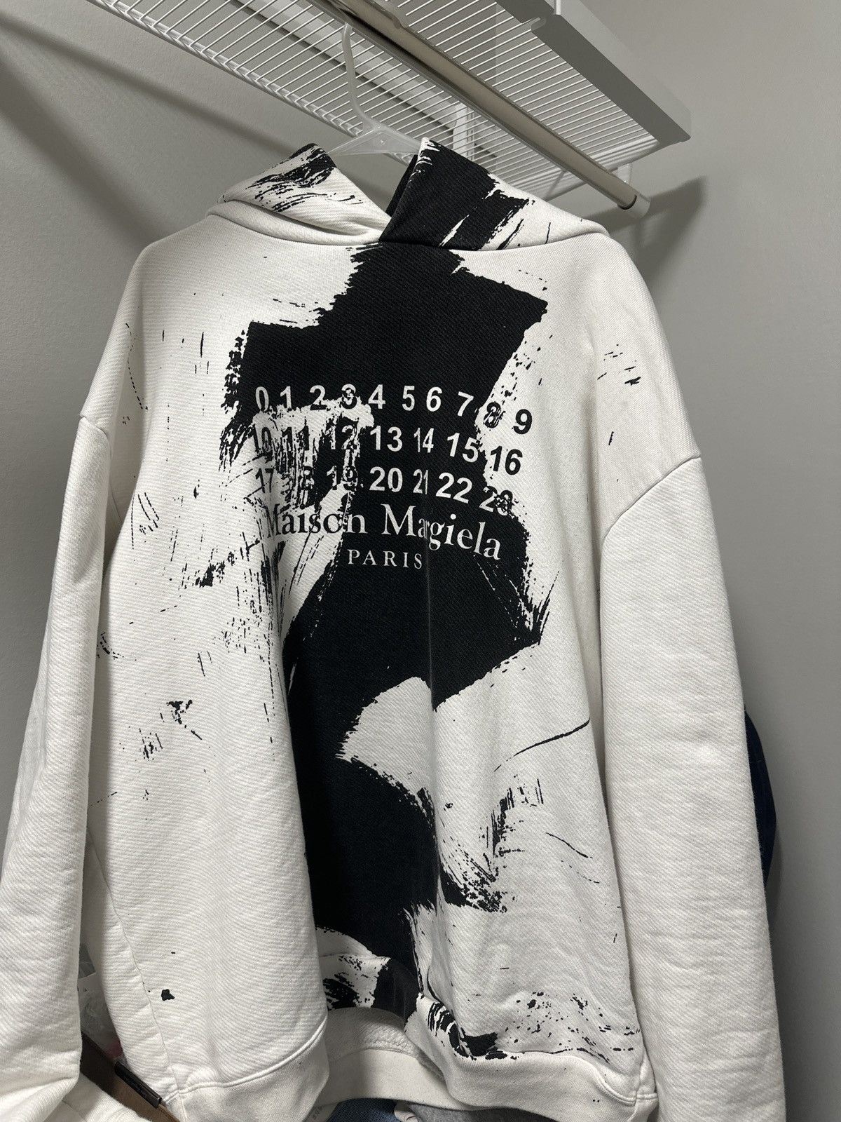image of Maison Margiela White Splash Ink Shield Hoodie in Black, Men's (Size Large)