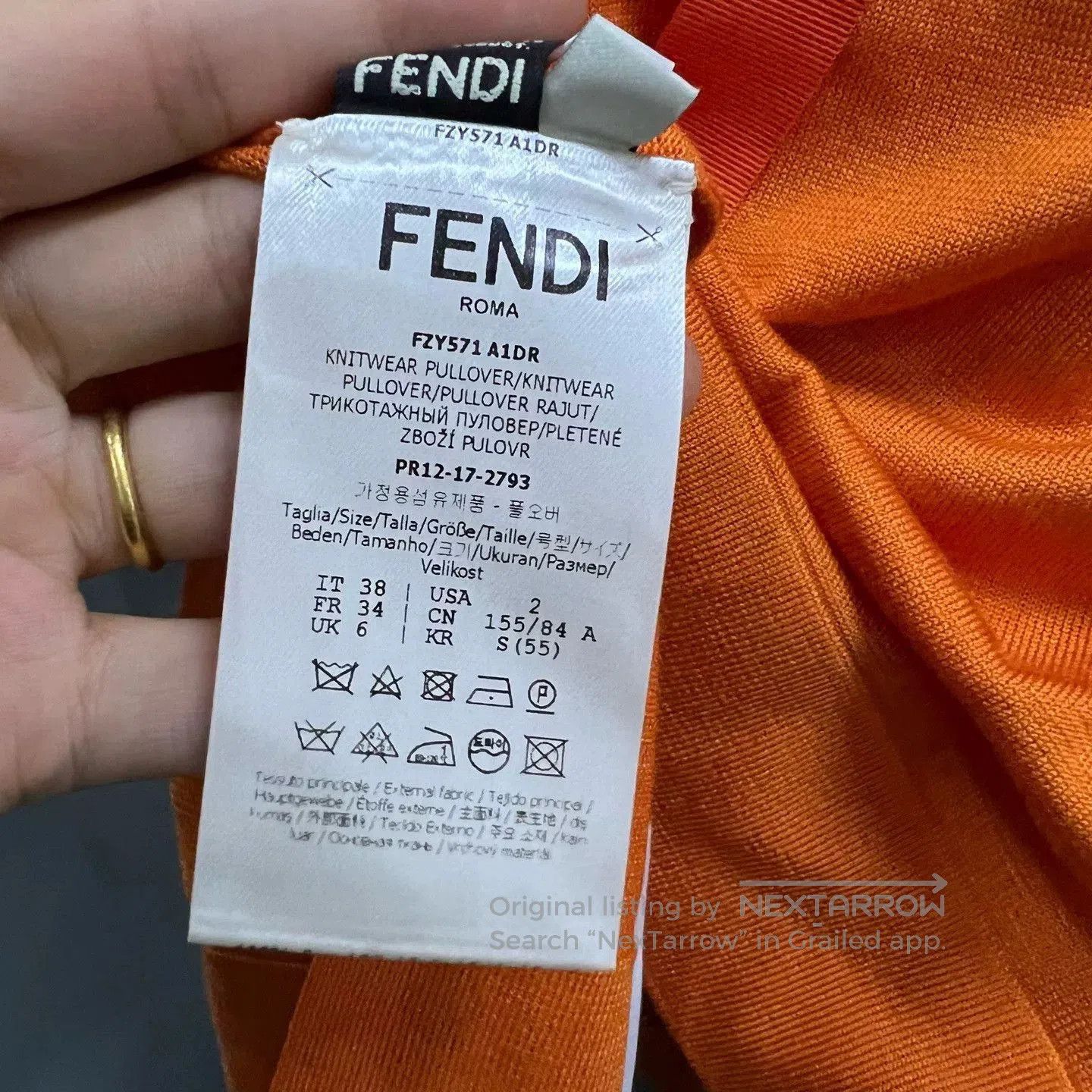 orange embroidered short sleeve sweater.