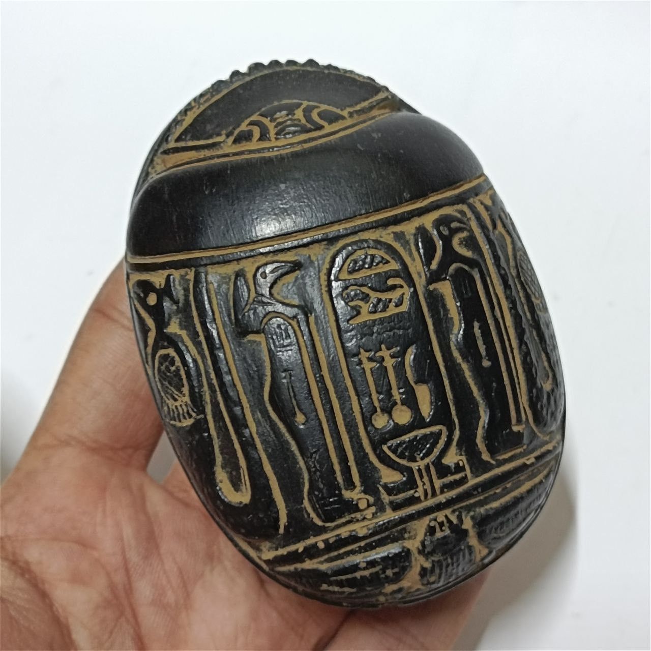 Ancient-style Egyptian scarab with engraved hieroglyphs