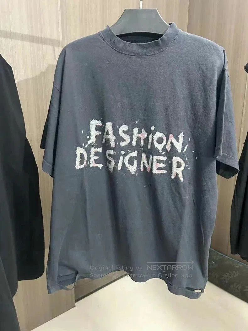 Balenciaga Black Distressed Logo T-shirt.