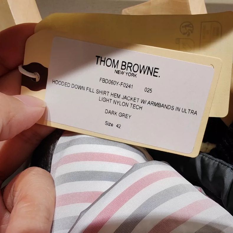 Thom Browne A striped down jacket with a hat