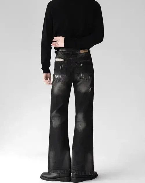 Smoky gray distressed micro-flared denim trousers