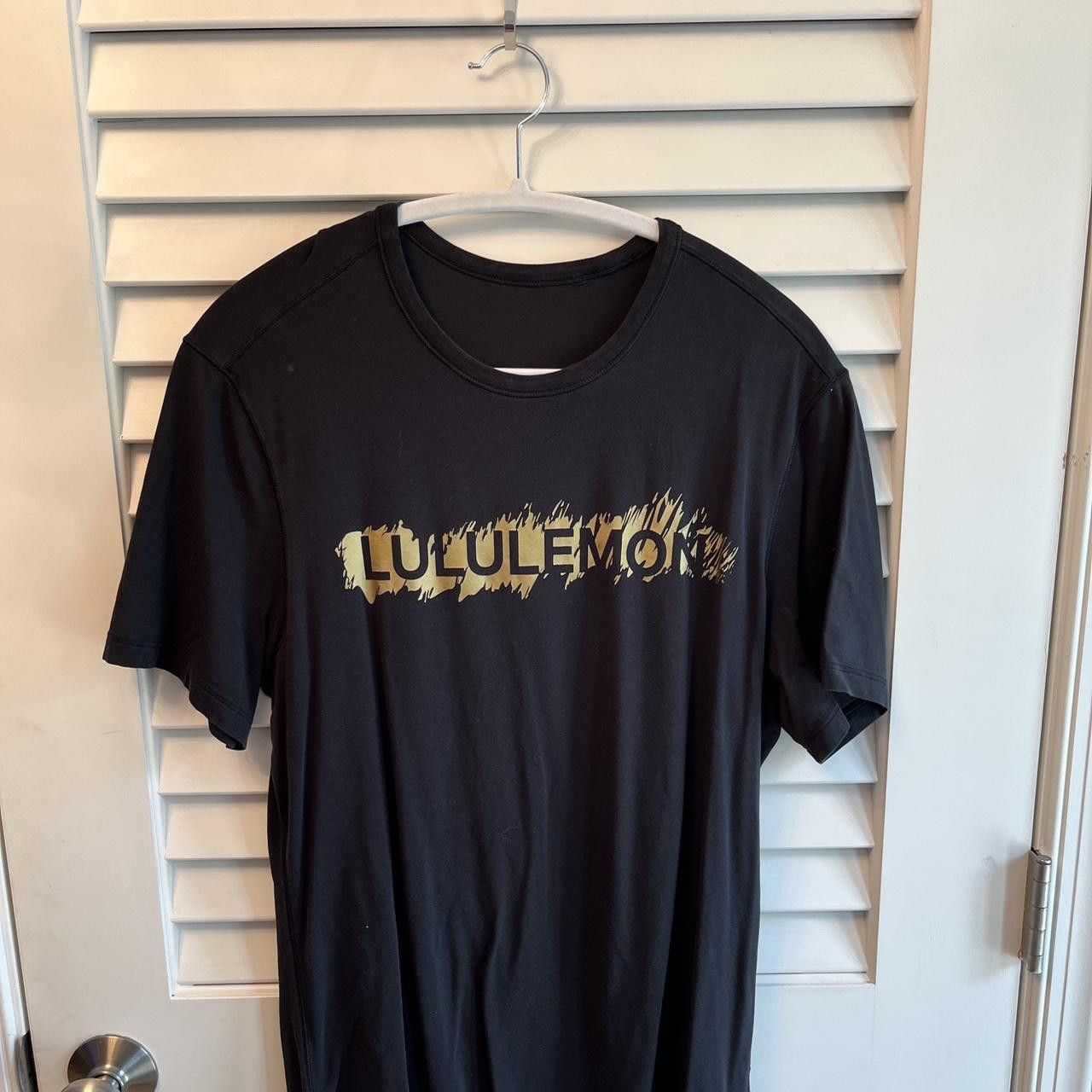 black lululemon 5 year basic T *LNY — gold logo decal