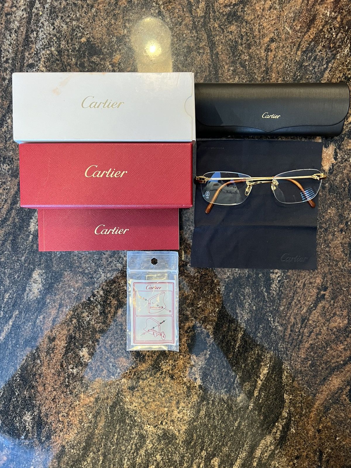 image of Cartier Frameless Glasses (Ct0050O) in Gold, Men's